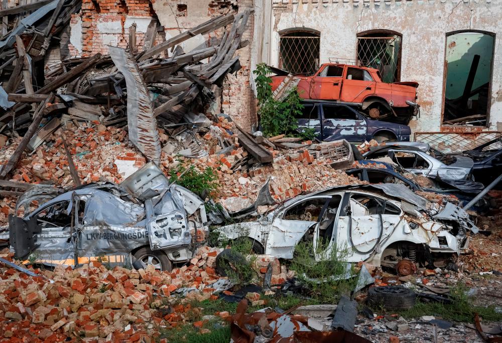 Destroyed cars are seen, as Russia’s attack on Ukraine continues, in the town of Izium, recently liberated by Ukrainian Armed Forces, in Kharkiv region, Ukraine/REUTERSPix