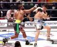 Boxer Floyd Mayweather of the U.S. throws a punch against mixed martial artist Mikuru Asakura of Japan during their exhibition match at Saitama Super Arena in Saitama, north of Tokyo, Japan/REUTERSPix
