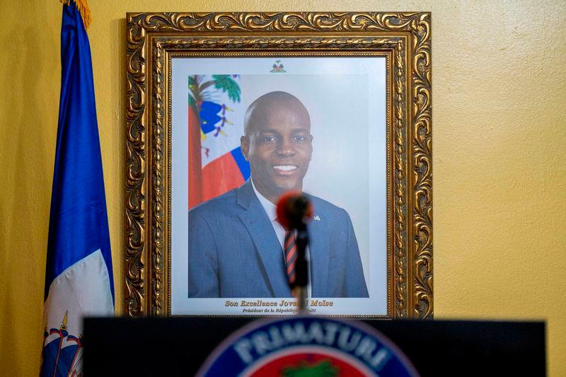 A picture of the late Haitian President Jovenel Moise hangs on a wall before a news conference by interim Prime Minister Claude Joseph at his house, almost a week after his assassination, in Port-au-Prince, Haiti July 13, 2021. REUTERSpix