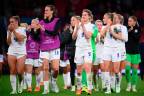 England’s players celebrate on the pitch after the UEFA Women’s Euro 2022 Group A football match between England and Austria at Old Trafford in Manchester, north-west England on July 6, 2022. England won the game 1-0./AFPPix