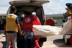 A handout picture released by the Syrian Red Crescent on September 23, 2022, shows rescuers transporting the body of a drowning victim into an ambulance in the Syria’s southern port City of Tartus, after a boat transporting migrants from Lebanon sank off the Syrian coast/AFPPix