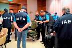 This handout photo taken and released on August 29, 2022 by the International Atomic Energy Agency (IAEA) shows IAEA team members preparing for departure at Vienna International Airport in Schwechat, Austria, before the team travels to Ukraine to inspect the Zaporizhzhia nuclear plant. AFPPix