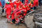 A handout picture provided by the Iranian Red Crescent (RCS) shows members of a rescue team working at the site of a flash flood in Emamzadeh Davoud, in the northwestern part of the capital Tehran/AFPPix