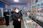 This picture taken on May 15, 2022 and released from North Korea's official Korean Central News Agency (KCNA) on May 16 shows North Korean leader Kim Jong Un (C) inspecting a pharmacy in Pyongyang. AFPPIX