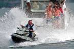 Brazilian President Jair Bolsonaro splashes people taking part a supporters’ boat ride on Paranoa Lake in Brasilia. - AFPpix