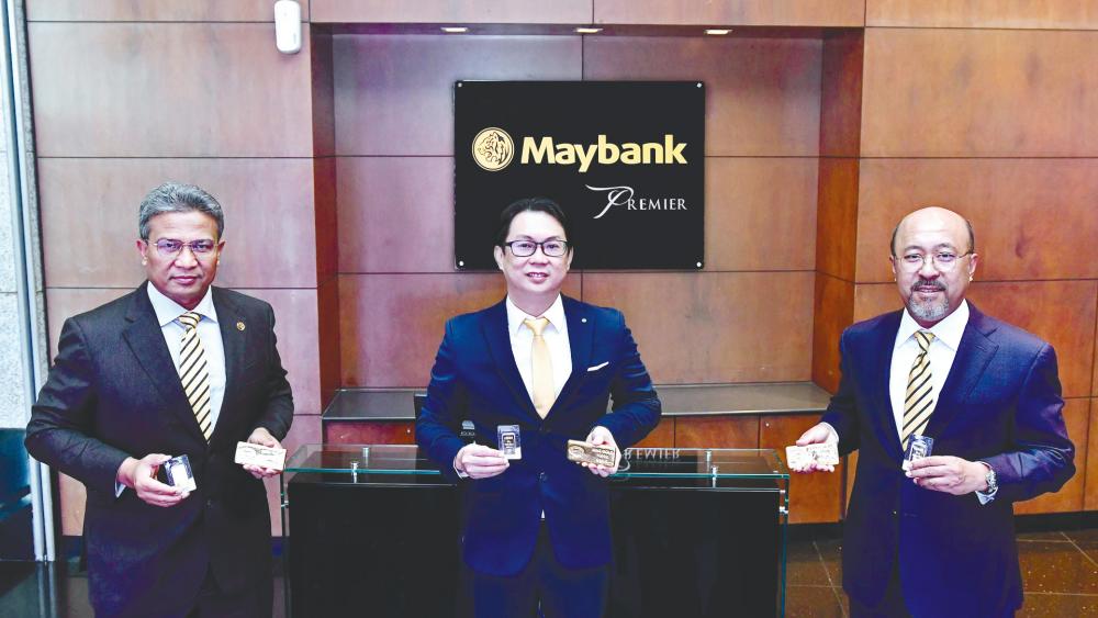 From left: Maybank head of Community Financial Services (Malaysia) Datuk Hamirullah Boorhan, ACE Innovate Asia Bhd CEO Go Yoong Chang and Mohamed Rafique.