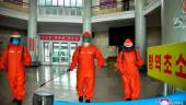 This picture taken on May 17, 2022 and released from North Korea's official Korean Central News Agency (KCNA) on May 18 shows railway station staff disinfecting Pyongyang station premises as a prevention measure against the Covid-19 coronavirus. KCNA VIA KNS/AFPpix