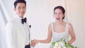 The happy couple during their March wedding. – AllKpop