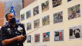 Ayob Khan showing the photos taken during the Ops Tapis Khas operation. – BERNAMAPIX