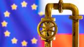 FILE PHOTO: A model of the natural gas pipeline is seen in front of displayed word EU and Russia flag colours in this illustration taken March 8, 2022. REUTERSPIX