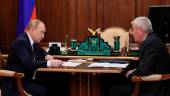 Russian President Vladimir Putin (L) meets with Head of Federal Financial Monitoring Service Yury Chikhanchin at the Kremlin in Moscow on June 27, 2022. AFPPIX