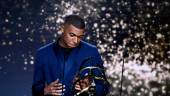 TOPSHOT - Paris Saint-Germain’s French forward Kylian MBappe receives the Best Ligue 1 Player award during the TV show on May 15, 2022 in Paris, as part of the 30th edition of the UNFP (French National Professional Football players Union) trophy ceremony. AFPPIX