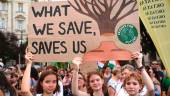 Young girls hold up a placard as they protest against the newly passed deforestation law, in front of the parliament building in Budapest, on August 12, 2022. AFPPIX