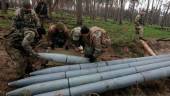 FILE PHOTO: Military sappers place a combat part of a Russian Uragan multiple rocket launch shell left after Russia’s invasion in Kyiv Region, Ukraine April 21, 2022. REUTERSPIX