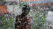A boy gets himself drenched in rainwater under a flyover during heavy rains. REUTERSPIX