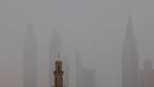 This picture taken on May 18, 2022 shows a view of the haze obscuring the skyline of the Gulf emirate of Dubai with a mosque in the foreground during a heavy sandstorm. AFPPIX