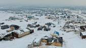 An aerial view shows a camp for internally displaced people covered in snow in the town of Azaz in the rebel-controlled northern countryside of Syria’s Aleppo province, on January 23, 2022.