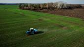 A tractor is seen spreading fertiliser on a wheat field near a village outside Kharkiv, Ukraine. The World Bank president says developing countries are being hit even harder given shortfalls of fertiliser and food stocks and energy supplies. – Reuterspix