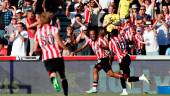 Brentford’s French midfielder Bryan Mbeumo (C) celebrates with teammates after scoring their fourth goal during the English Premier League football match between Brentford and Manchester United at Brentford Community Stadium in London on August 13, 2022. AFPPIX
