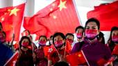 People hold the Hong Kong and Chinese flags while singing to celebrate the 25th anniversary of the city’s handover from Britain to China, in Hong Kong on July 1, 2022. AFPPIX