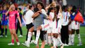 Lyon’s French defender Wendie Renard celebrates with a trainer after winning the UEFA Women’s Champions League Final football match between Spain’s Barcelona and France’s Lyon at the Allianz Stadium in the Italian city of Turin on May 21, 2022. AFPPIX