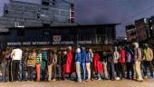 A group of voters queue while waiting for the polling station to open during Kenya's general election at St. Stephen School polling station in the informal settlement of Mathare in Nairobi, Kenya, on August 9, 2022. - AFPPIX