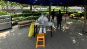 A medical worker in a protective suit works at a makeshift nucleic acid testing site, amid the coronavirus disease (Covid-19) outbreak, in Beijing, China May 23, 2022. REUTERSpix