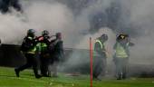 A riot police officer fires tear gas after the football match between Arema vs Persebaya at Kanjuruhan Stadium, Malang, East Java province, Indonesia, October 1, 2022 - REUTERSPIX