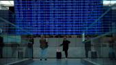 This photograph taken on September 16, 2022, shows travellers looking at the departure information panel of the Terminal 2 of the Roissy-Charles de Gaulle airport, in the northeastern outskirts of Paris, as it announces multiple cancelled flights amid a strike of air traffic controllers. AFPPIX