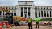 Construction workers looking on outside the Federal Reserve building in Washington on Tuesday, July 26. The US central bank has been raising interest rates aggressively – with the latest big increase on Wednesday – to try to cool the economy and tamp down price pressures. – AFPpix