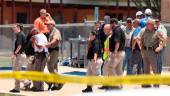 A law enforcement officer is led from the scene while a mass shooting was underway at Robb Elementary School where a gunman killed nineteen children and two adults in Uvalde, Texas, U.S. May 24, 2022.Pete Luna/Uvalde Leader-News/Handout via REUTERSpix