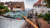 A roof batten is stuck in the windshield of a parked car in Paderborn, western Germany on May 20, 2022, after a storm also caused major damage. More than 30 people were injured, “including ten seriously” in Paderborn, a town in western Germany which was crossed by a “tornado”. AFPPIX