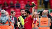 Liverpool's Egyptian midfielder Mohamed Salah celebrates with his two trophies golden boot and playmaker of the year at the end of the English Premier League football match between Liverpool and Wolverhampton Wanderers at Anfield in Liverpool, north west England on May 22, 2022. AFPpix