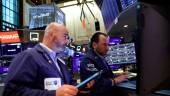 Traders working on the trading floor at the New York Stock Exchange. – Reuters