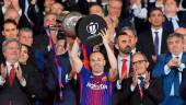 Barcelona’s Spanish midfielder Andres Iniesta (C) holds the trophy after the Spanish Copa del Rey (King’s Cup) final football match Sevilla FC against FC Barcelona at the Wanda Metropolitano stadium in Madrid on April 21, 2018. Barcelona won 5-0. AFPPIX
