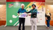 Perodua chairman Tan Sri Asmat Kamaludin presents the prize to Group A winner Anushka Gayan Wijerathne.