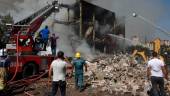 Rescue workerS operate on the site of a retail market in the Armenian capital Yerevan on August 14, 2022, after an explosion sparked a fire, killing one person and injuring 51, according to the emergency situations ministry. AFPPIX