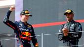 Red Bull's Max Verstappen celebrates on the podium after winning the race alongside second place Mercedes' Lewis Hamilton REUTERSpix