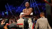 FILE PHOTO: Floyd Mayweather, Jr. stands up on the ropes in his corner after defeating Manny Pacquiao. REUTERSPIX