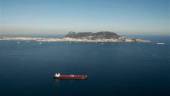 FILE PHOTO: A merchant marine ship sails past the Rock of Gibraltar in the Strait of Gibraltar in this general aerial view taken October 26, 2010. REUTERSPIX