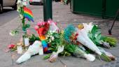 Flowers and a rainbow flag are placed on the sidewalk as a tribute to the victims of a shooting at the London Pub, a popular gay bar and nightclub, in central Oslo, Norway June 25, 2022. REUTERSPIX