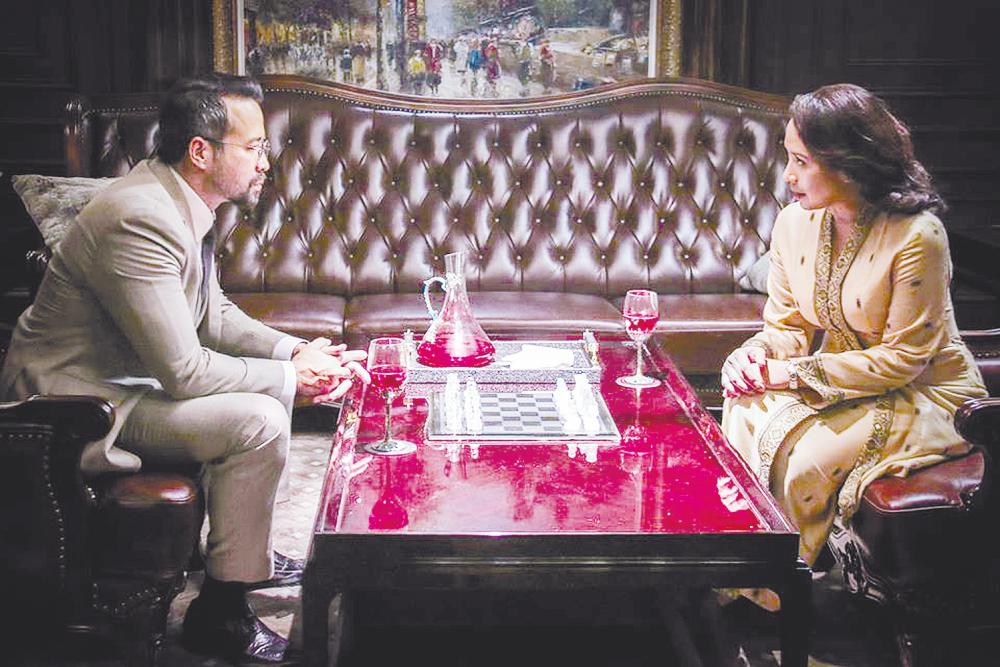 $!A scene from Daulat, a political thriller starring Tony Eusoff (left) and Vanidah Imran. – Lacuna Pictures