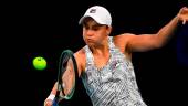 Australia’s Ashleigh Barty hits a return against Amanda Anisimova of the US during their women’s singles match on day seven of the Australian Open in Melbourne on Jan 23, 2022. – AFPPIX
