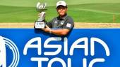 Korea’s Kim Joohyung with the winners trophy. – Paul Lakatos/Asian Tour