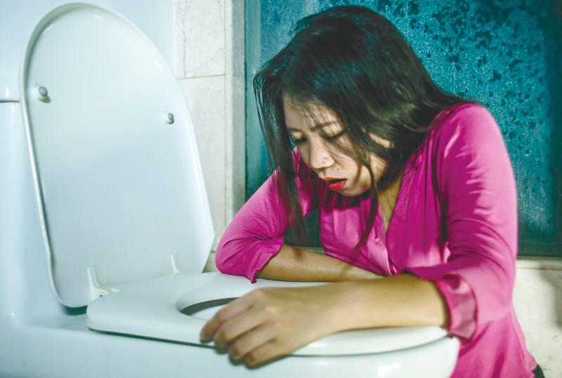 Vomiting is an automatic response that causes the stomach contents to be thrown thru the mouth. –123RF