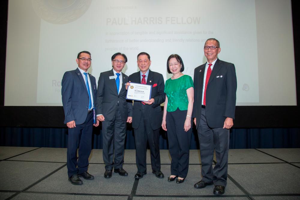 Third from left: Prof Datuk Dr Paul Chan was handed the Paul Harris Fellow Award for his innumerable contributions to REF.