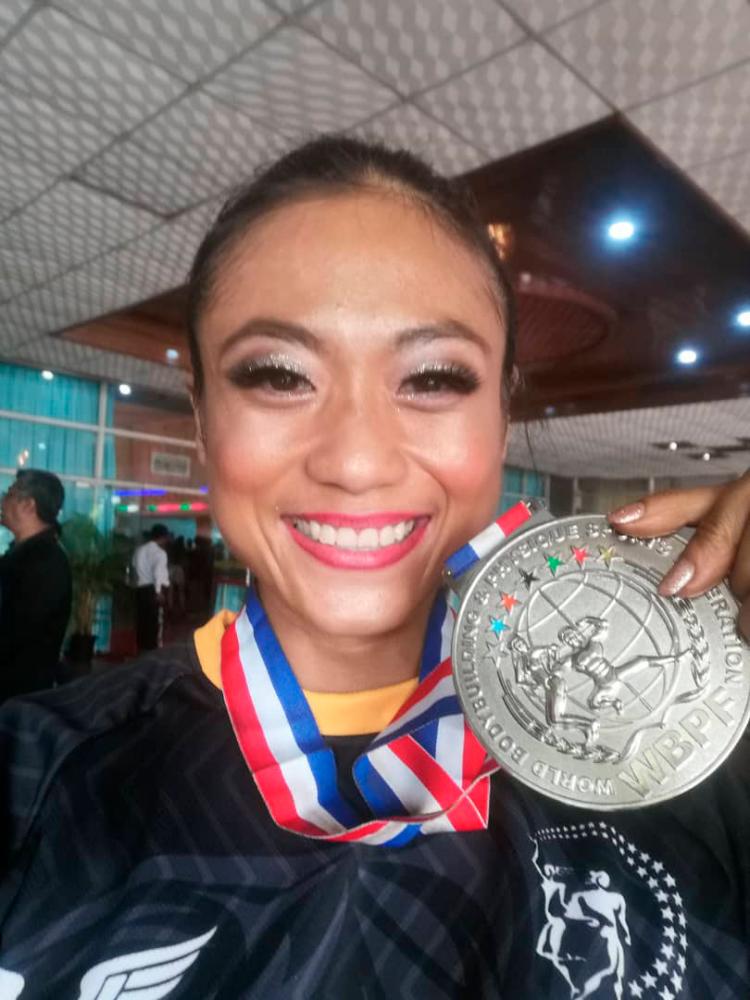 $!Philomena earned a silver medal at the 16th South East Asia Bodybuilding and Physique Sports Championship. — PHOTO COURTESY OF PHILOMENA DEXCLYN