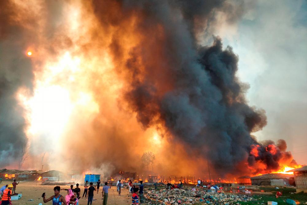 Smoke billows at the site of the Rohingya refugee camp where fire broke out in Cox’s Bazar, Bangladesh, March 22, 2021.- Reuters