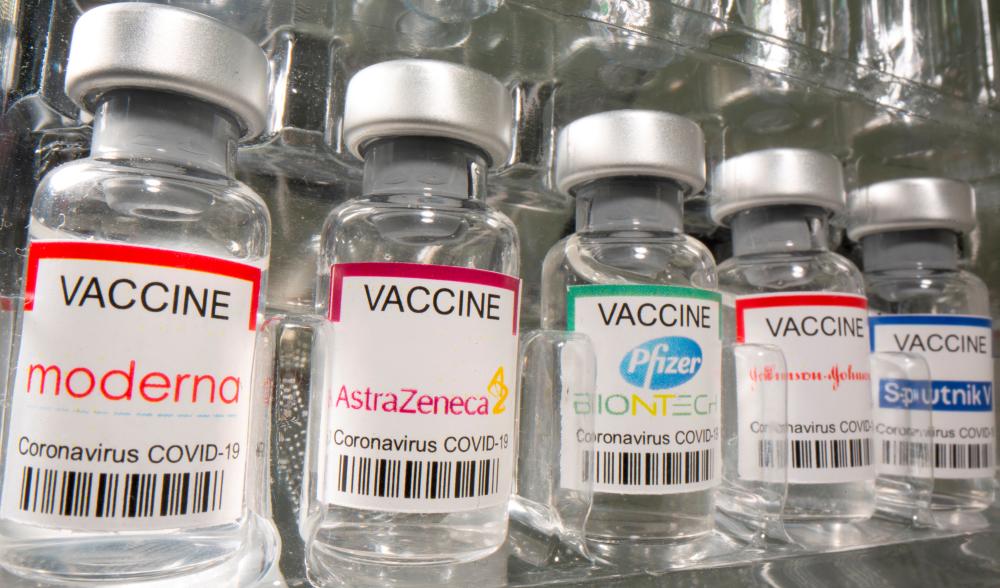 FILE PHOTO: Vials labelled Moderna, AstraZeneca, Pfizer - Biontech, Johnson&amp;Johnson, Sputnik V coronavirus disease (COVID-19) vaccine are seen in this illustration picture taken May 2, 2021. REUTERSpix