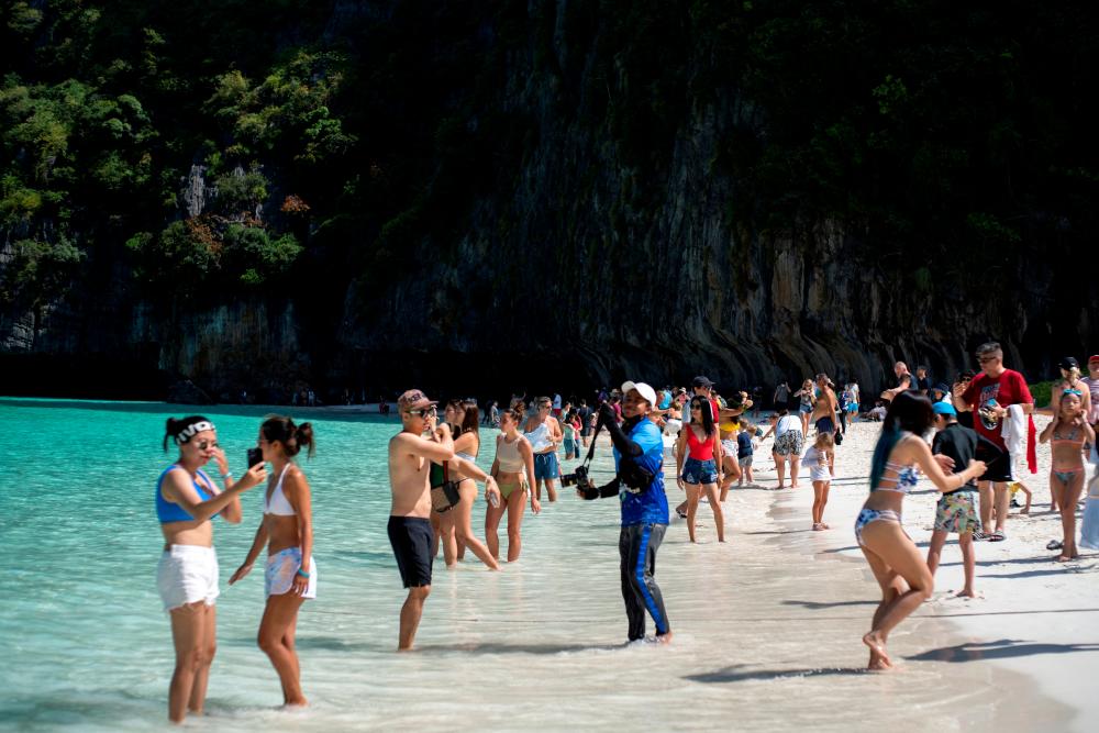 Tourists visit Maya bay after Thailand reopened its world-famous beach after closing it for more than three years to allow its ecosystem to recover from the impact of overtourism, at Krabi province, Thailand, January 3, 2022. REUTERSPIX